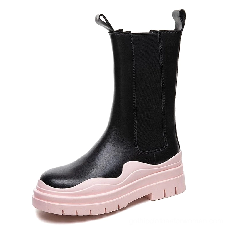Women's black leather platform boots with pink chunky sole, romantic goth styling, three-quarter front view showing rounded toe