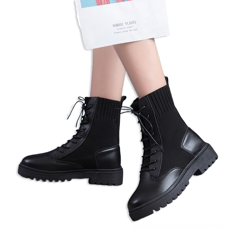 Black gothic lace-up ankle combat boots - women modeling rear side view with mixed leather knit upper