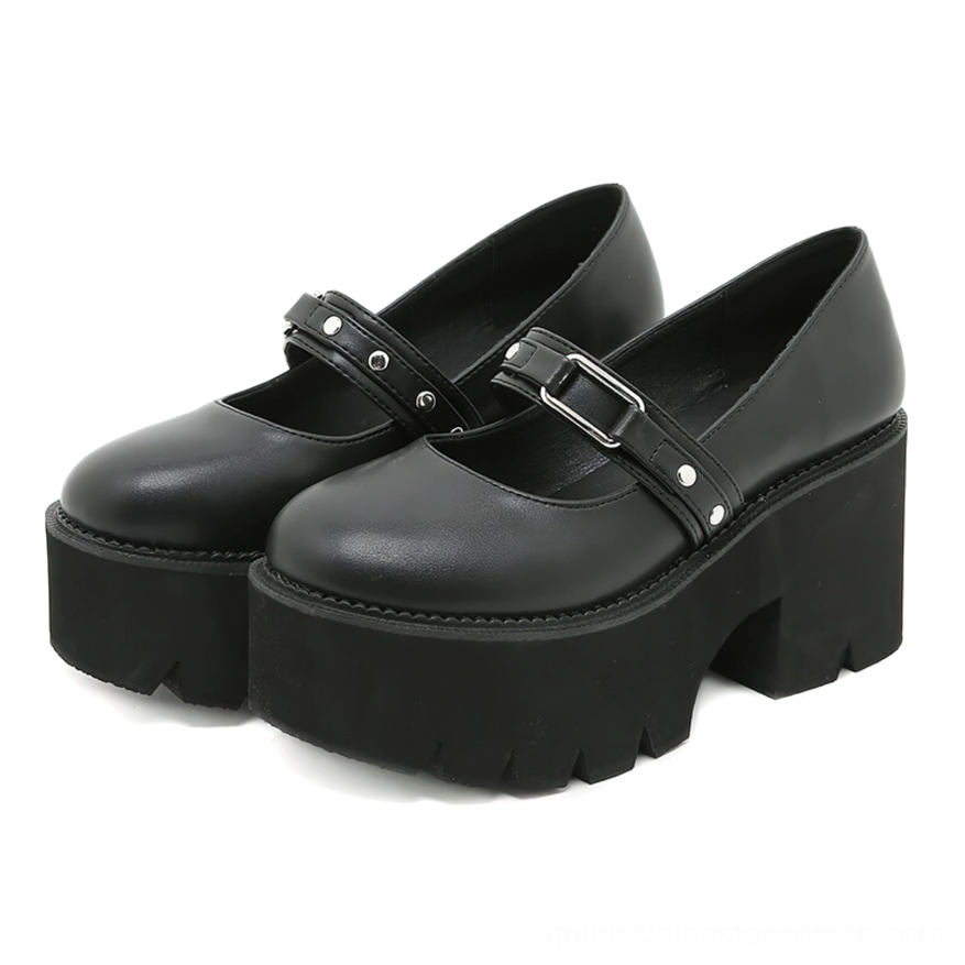 Black platform Mary Jane shoes with buckle strap, front view showing sleek PU leather construction and architectural square heel