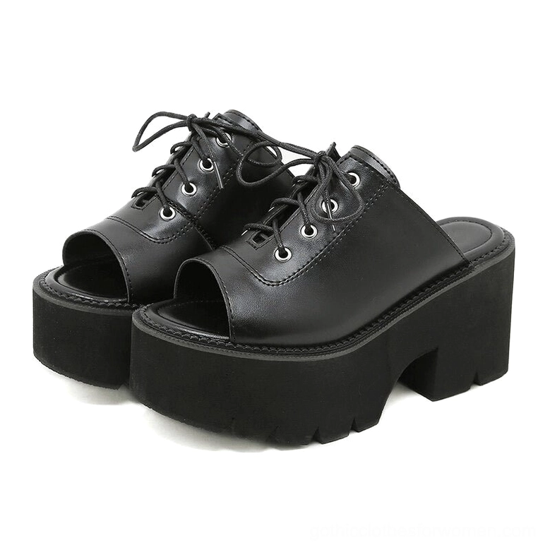 Black platform lace-up mule sandals three-quarter front view showing open toe slip-on design