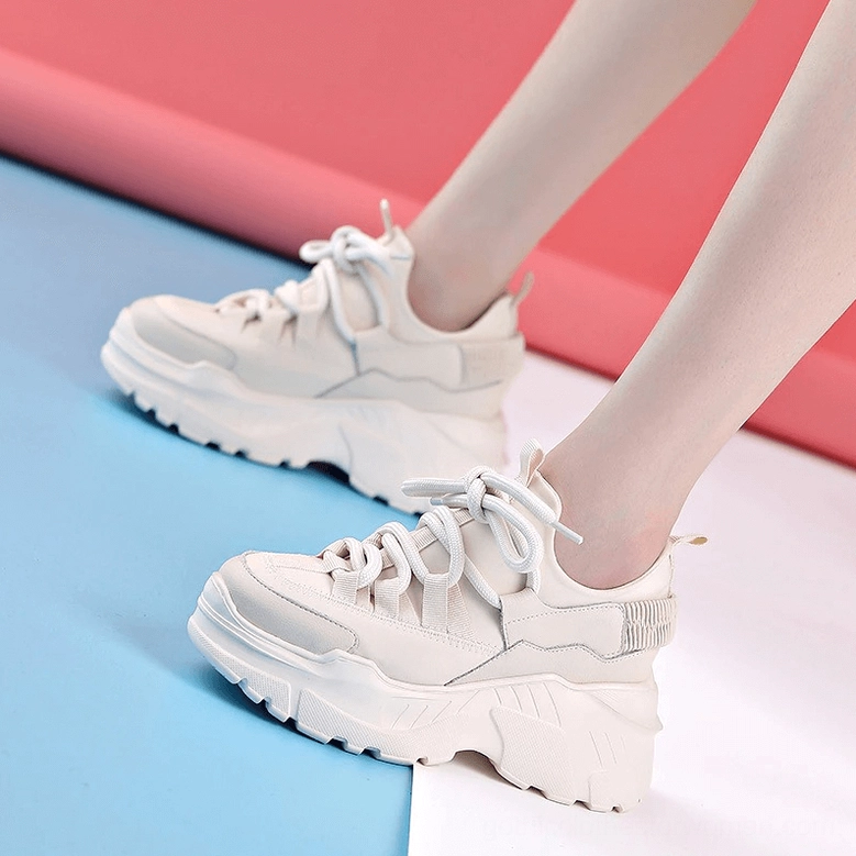 Black women's platform sneaker front toe view showing lace-up design and upper texture