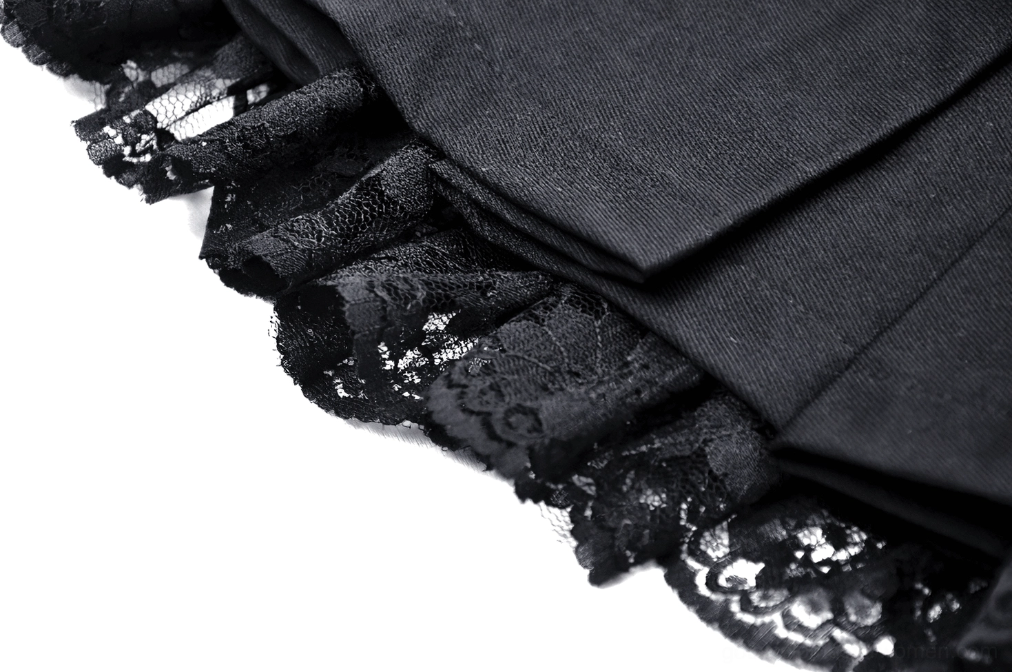Black pleated gothic mini skirt showcasing overall silhouette with metal O-ring details and lace trim accents