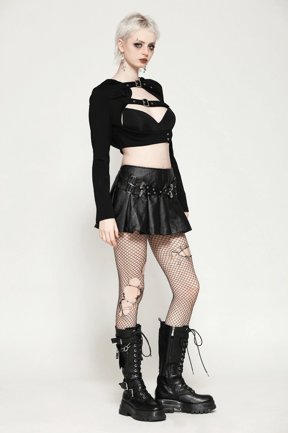 Black pleated faux leather gothic mini skirt detail view emphasizing material quality and buckle hardware accents
