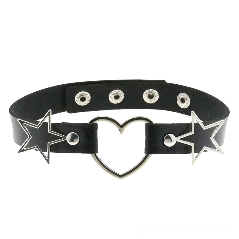 Flat lay of black PU leather gothic choker with adjustable snap fasteners, silver heart pendant and hollow star ornaments displayed on white background
