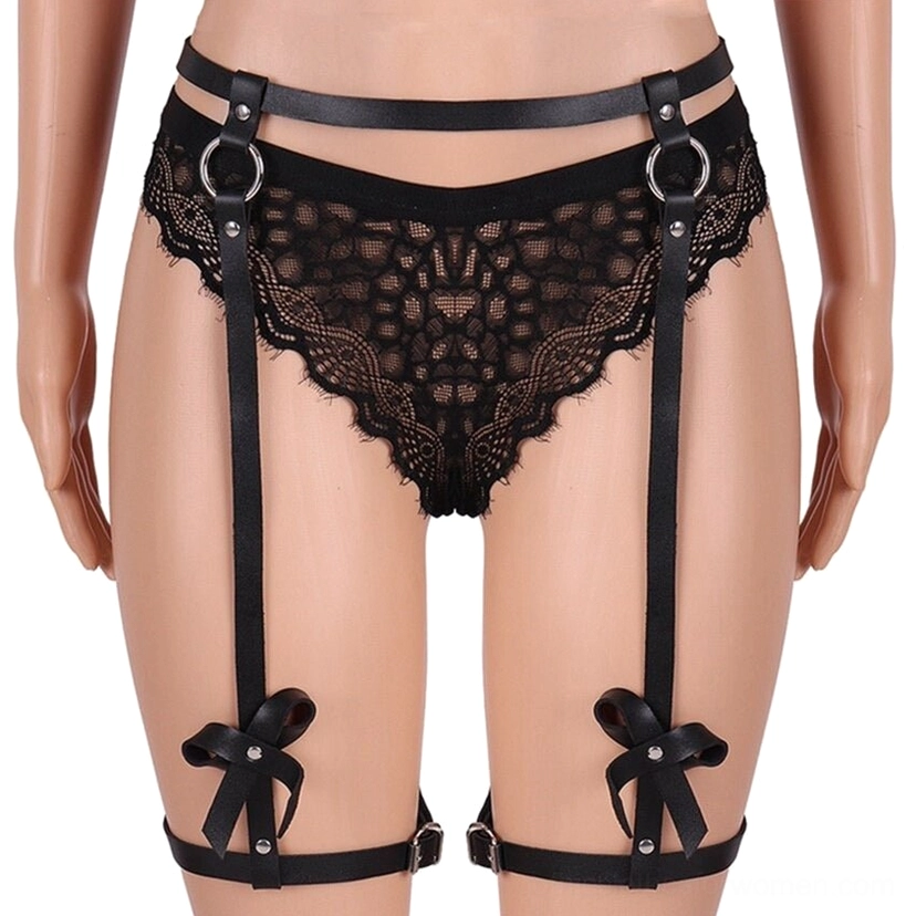 Women's black PU leather thigh harness with bow embellishments on model mannequin, front close-up view showing waist belt and adjustable leg straps