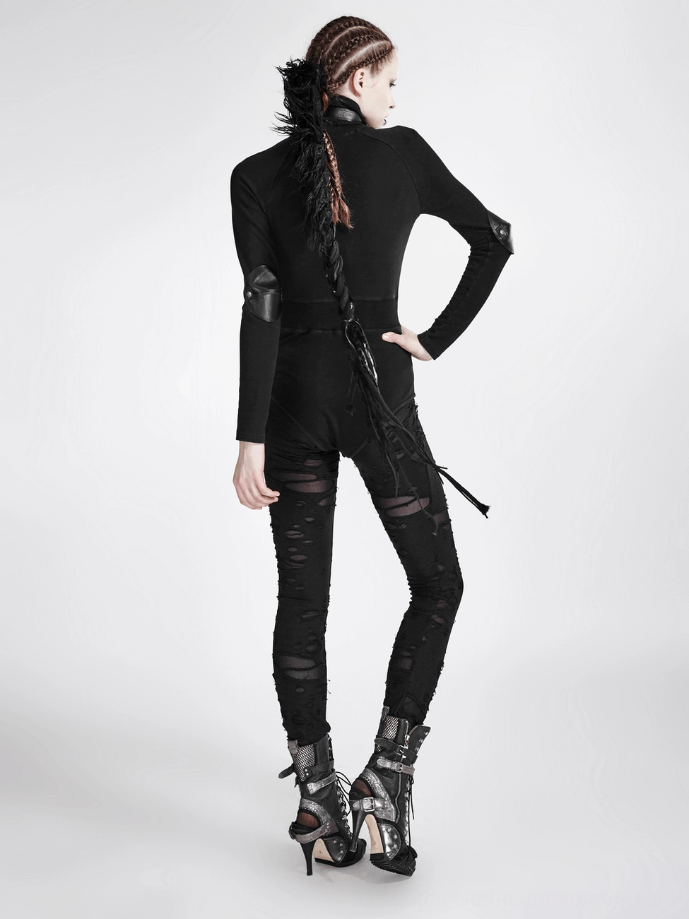 Full view of black gothic leggings with artistic ripped mesh design and punk aesthetic