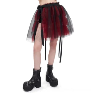 Black and red gothic mesh skirt with tiered tulle, ribbon straps and split hem worn by female model in studio setting