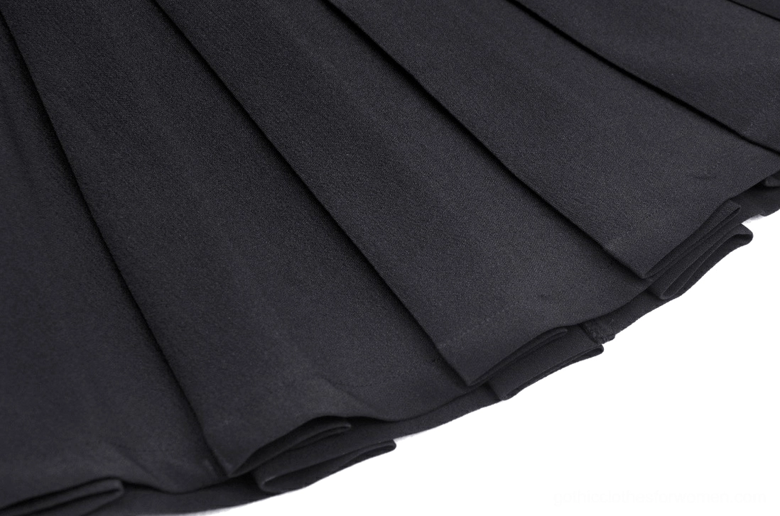 Close-up of crisp pleated black fabric texture showing construction quality of gothic mini skirt