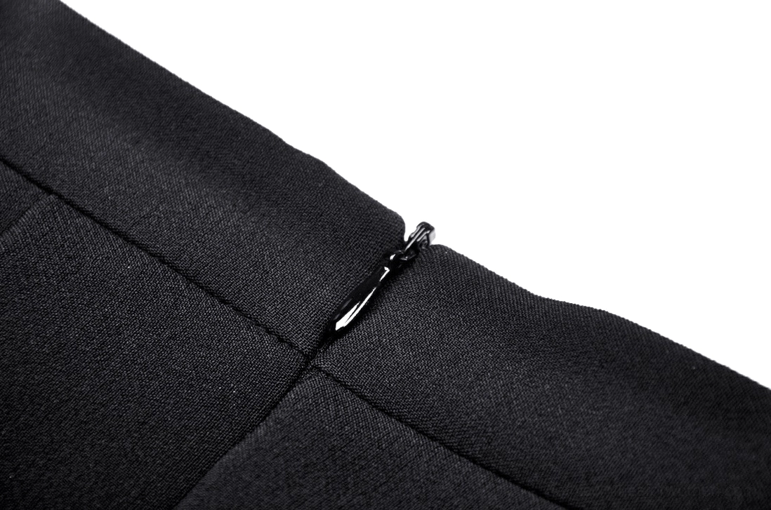 Side close-up view of black and red tartan gothic pleated mini skirt showing structural design and hardware