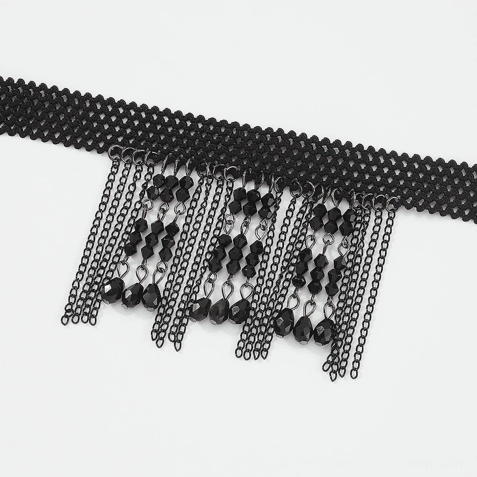 Partial flat lay view of black choker necklace showing woven mesh collar detail and hanging chain tassels with black beads