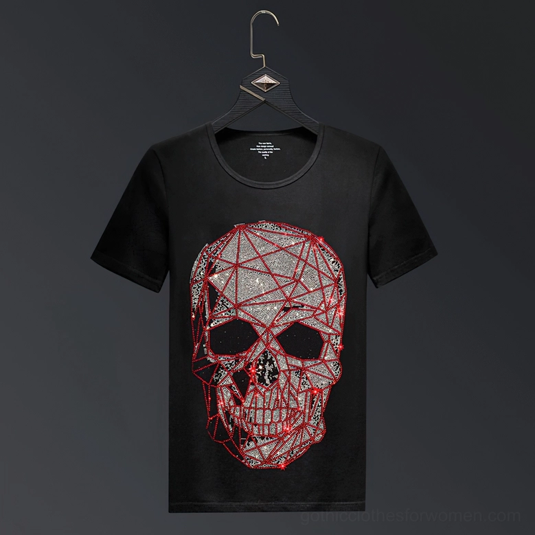 Black gothic t-shirt with rhinestone skull graphic hung on display against dark background
