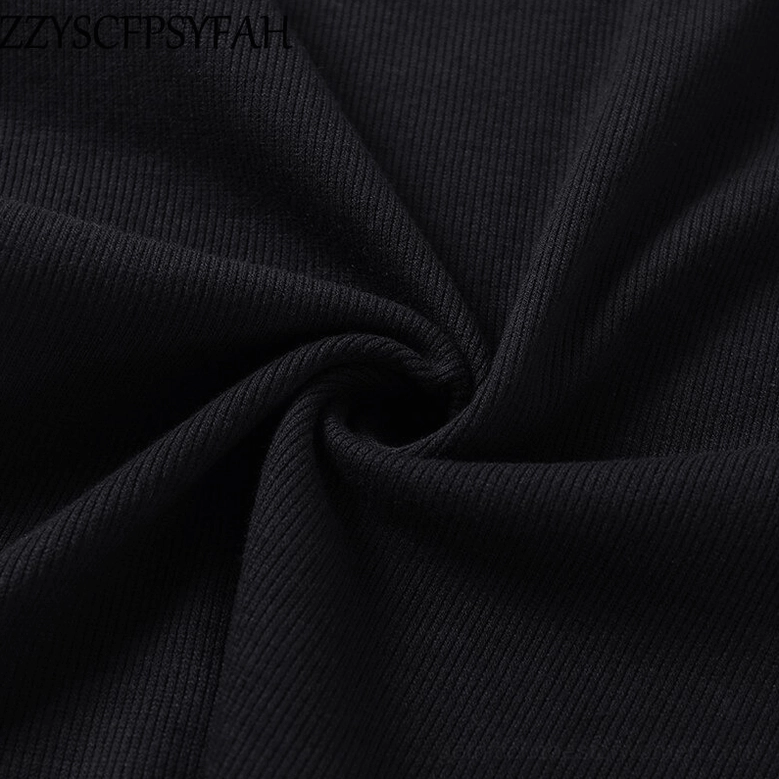 Black ribbed knit fabric texture close-up showing vertical stretch ribbed pattern