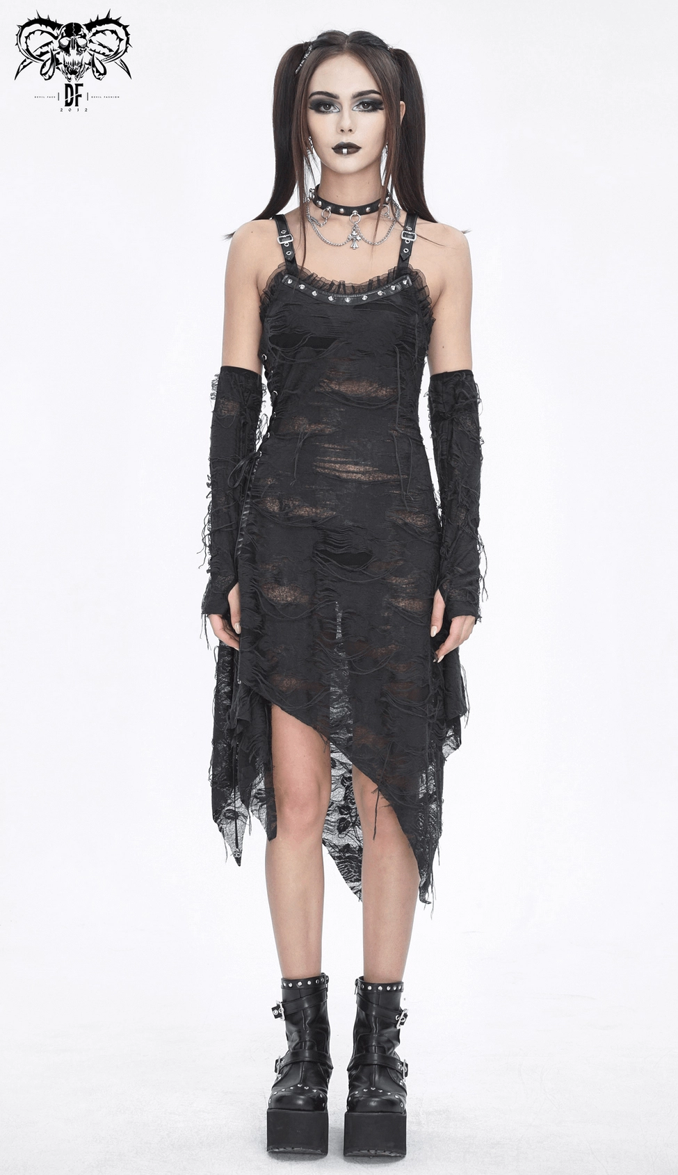 Black ripped gothic dress with long gloves styled for alternative nightlife, complete look with accessories