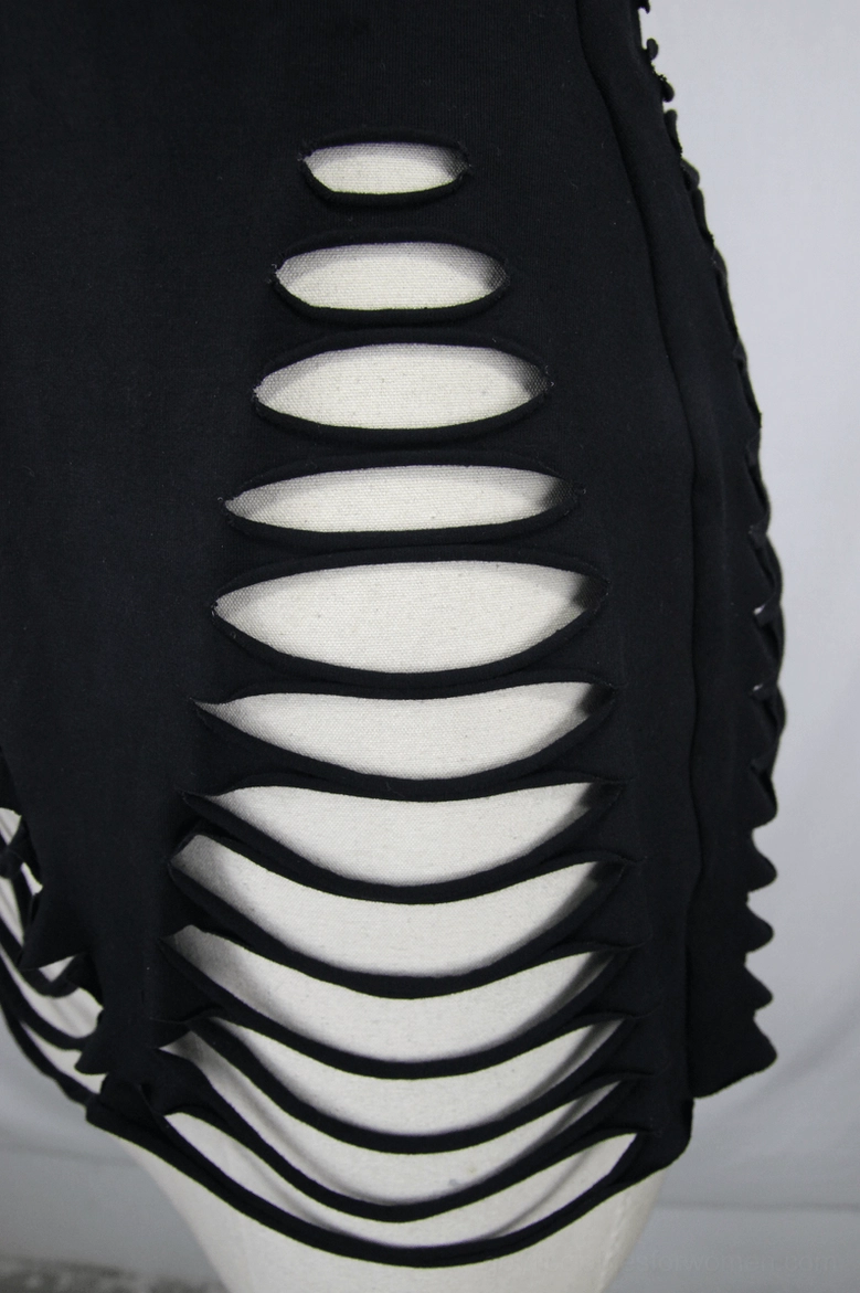 Black ripped gothic tank top detail view of side slits and slim fit construction