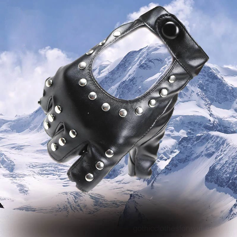 Studded fingerless PU gloves close-up side view on hand with red leather handbag background, silver rivet decorations