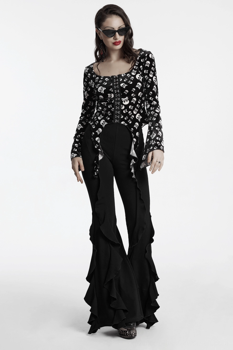 Black ruffle flare gothic pants overall aesthetic display in studio setting showing complete silhouette