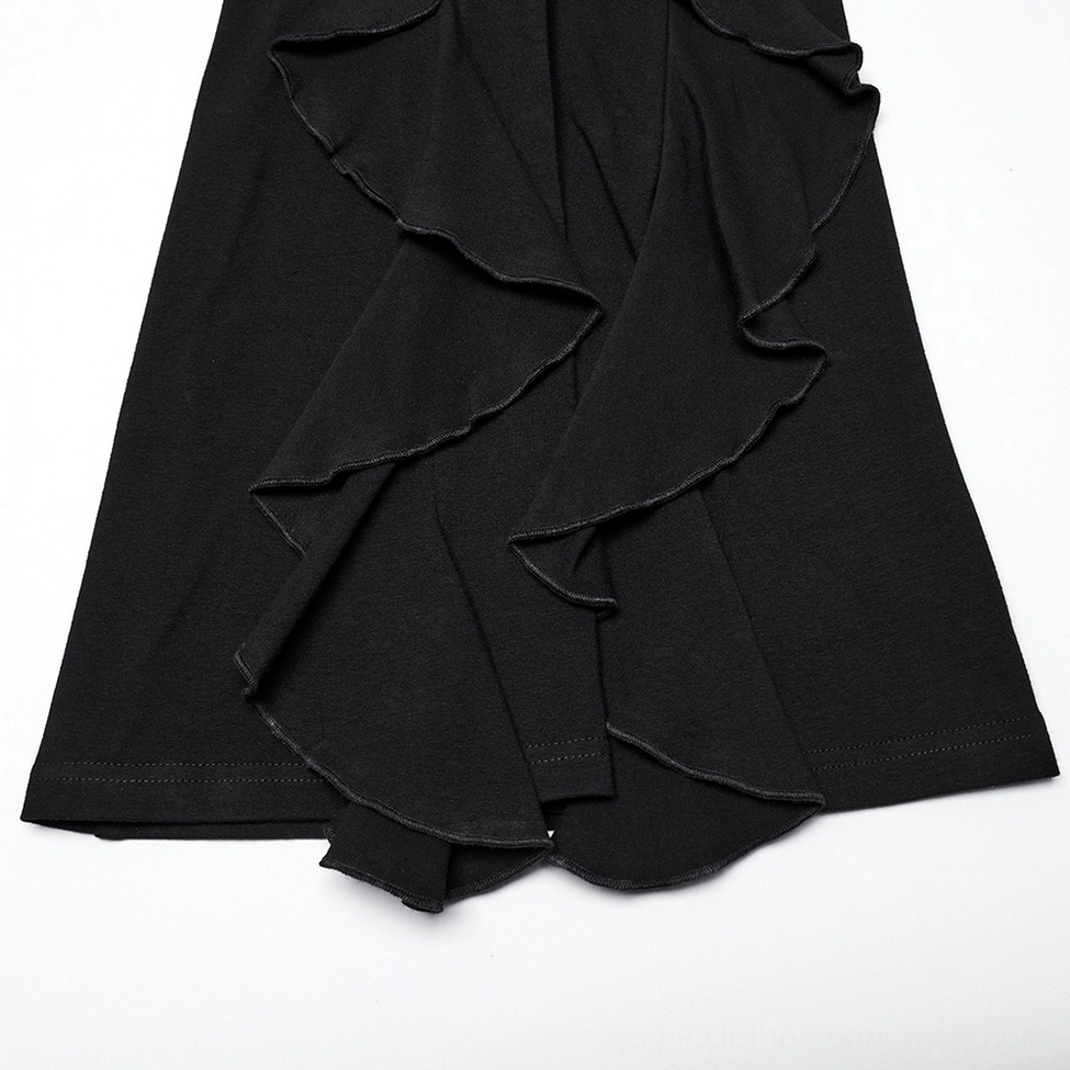 Black ruffle flare gothic pants hem close-up showing multi-layer draped ruffles and soft knit fabric texture
