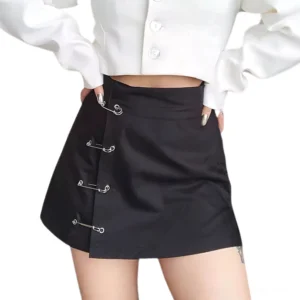 Black safety pin mini skirt front view with high-waist silhouette and silver pin accents on fitted a-line gothic dress