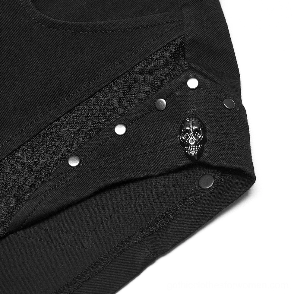 Side mesh panel close-up showing fishnet insert and skull stud hardware on punk denim shorts