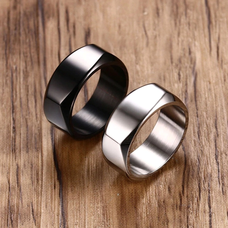 Black and silver stainless steel gothic band rings pair displayed together showing both color options with minimalist design