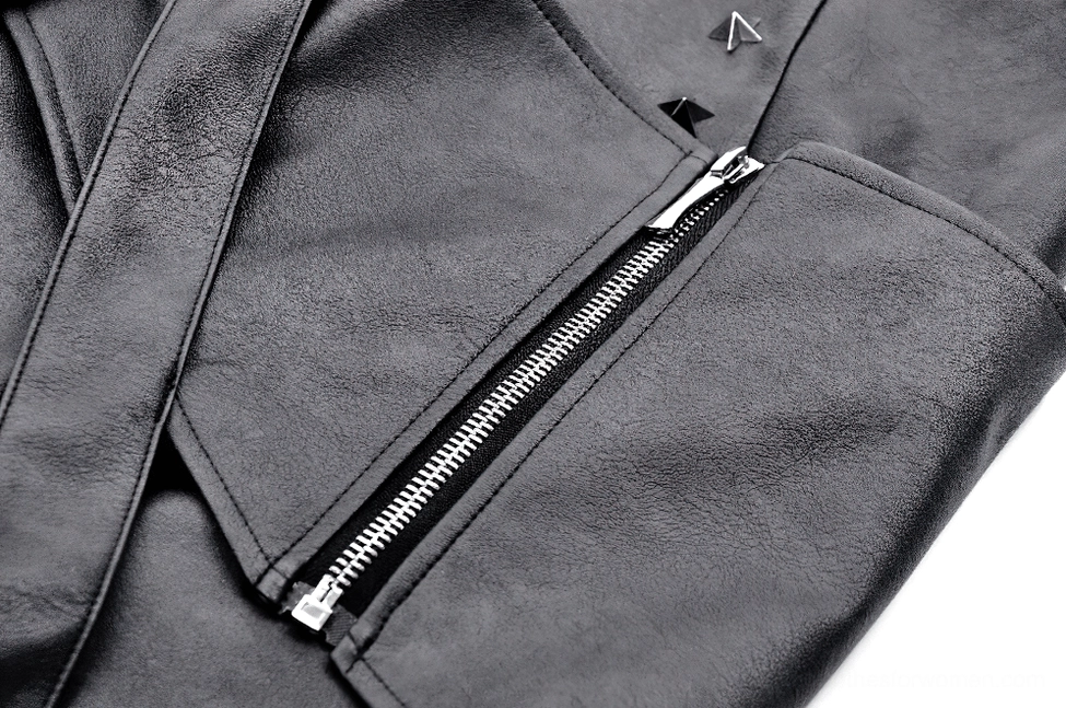 Macro view of black faux leather skirt side zipper with silver metal closure and stitched fabric seams