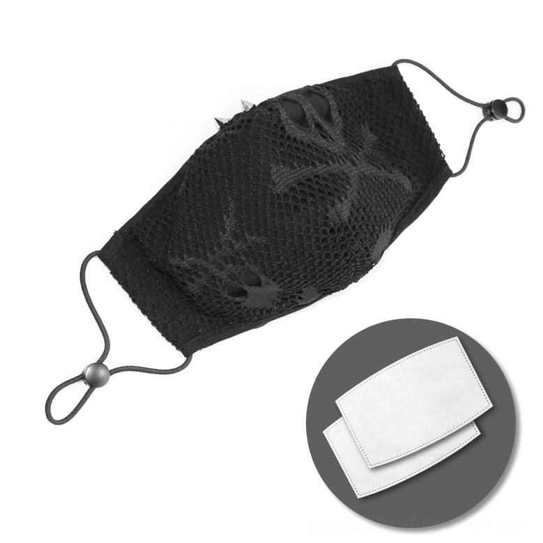 Black skull mesh gothic face mask flat lay top view with replaceable filter pads included