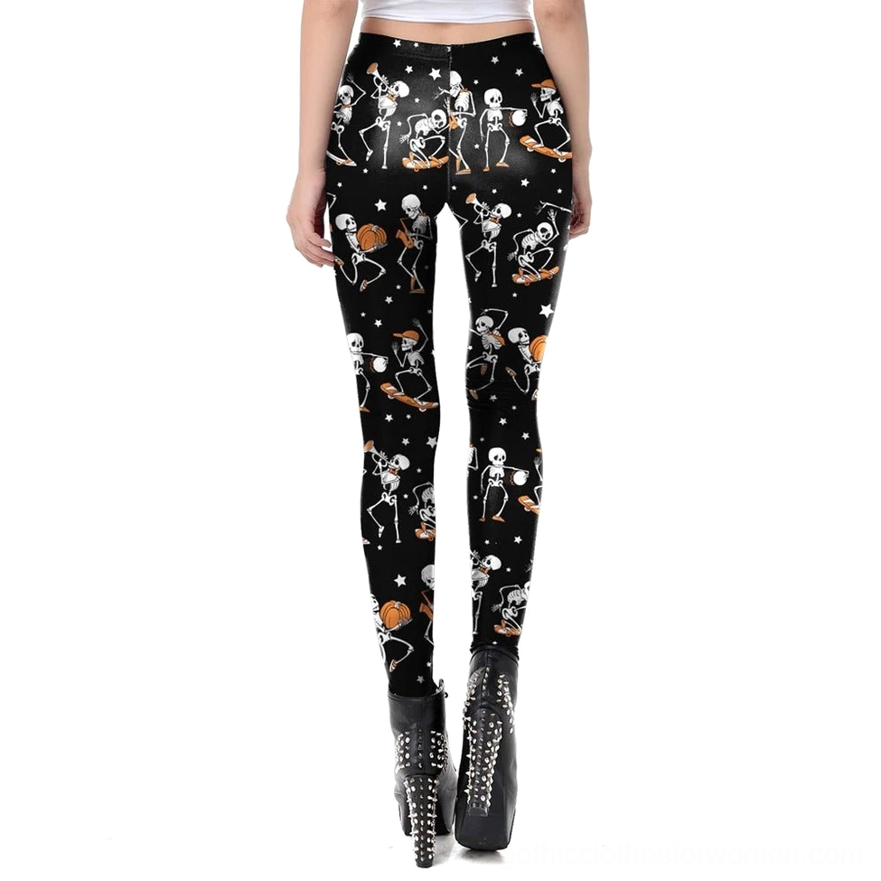 Black skeleton print gothic leggings rear three-quarter view, styled with studded ankle boots and alternative fashion styling