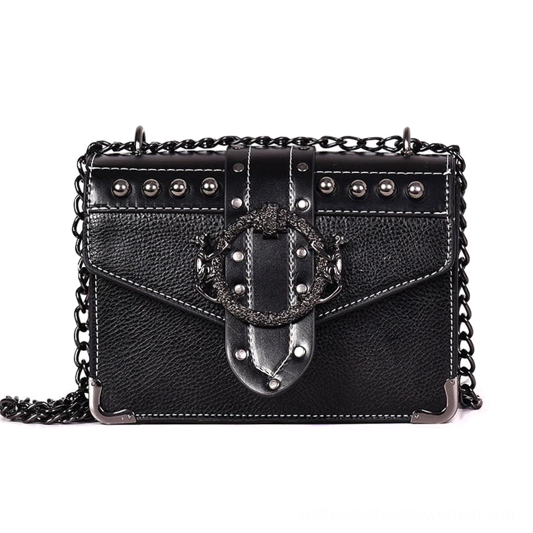 Black gothic studded square shoulder bag with skull rivets, ornate hasp lock, and metal chain strap - front view