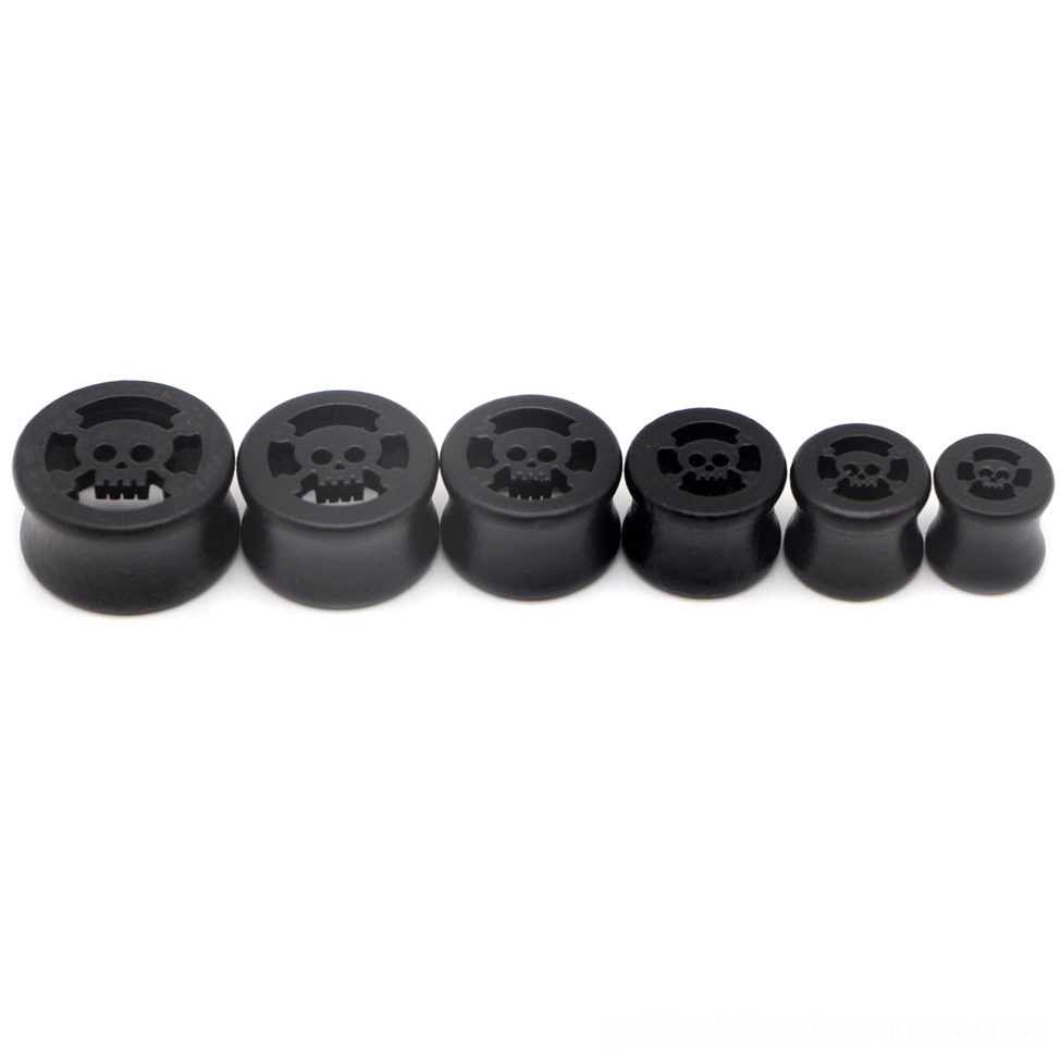Gothic black wood ear gauges with skull star pattern, studio shot displaying side angle of the tunnel plug design and carved detail work