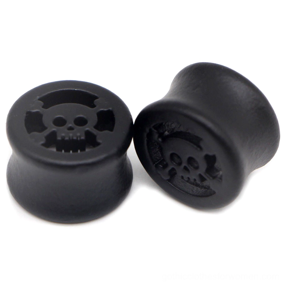 Black skull star ear gauge tunnel plug stretcher in matte finish, showing carved skull design and smooth polished surface, multiple sizes available for gothic ear stretching