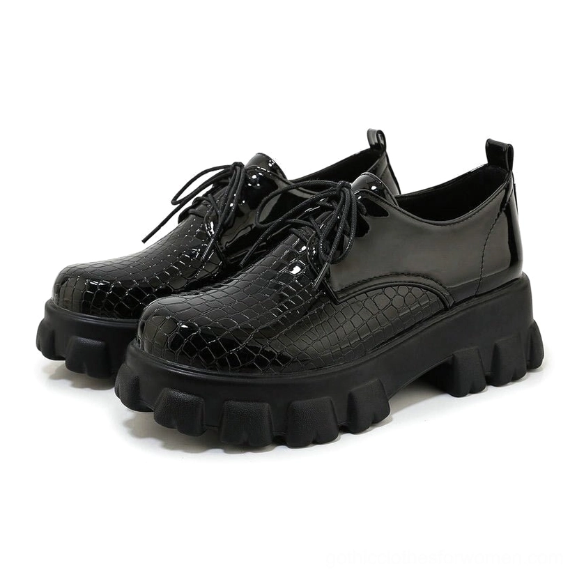 Black snake-texture patent leather lace-up platform pump, front three-quarter view, showing round toe and 6cm square heel on white background