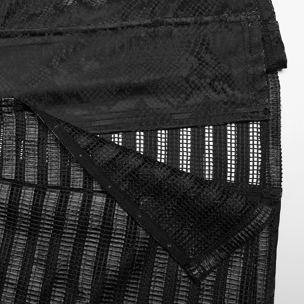 Detailed close-up of black snake print dress showing layered striped mesh fabric and seam construction