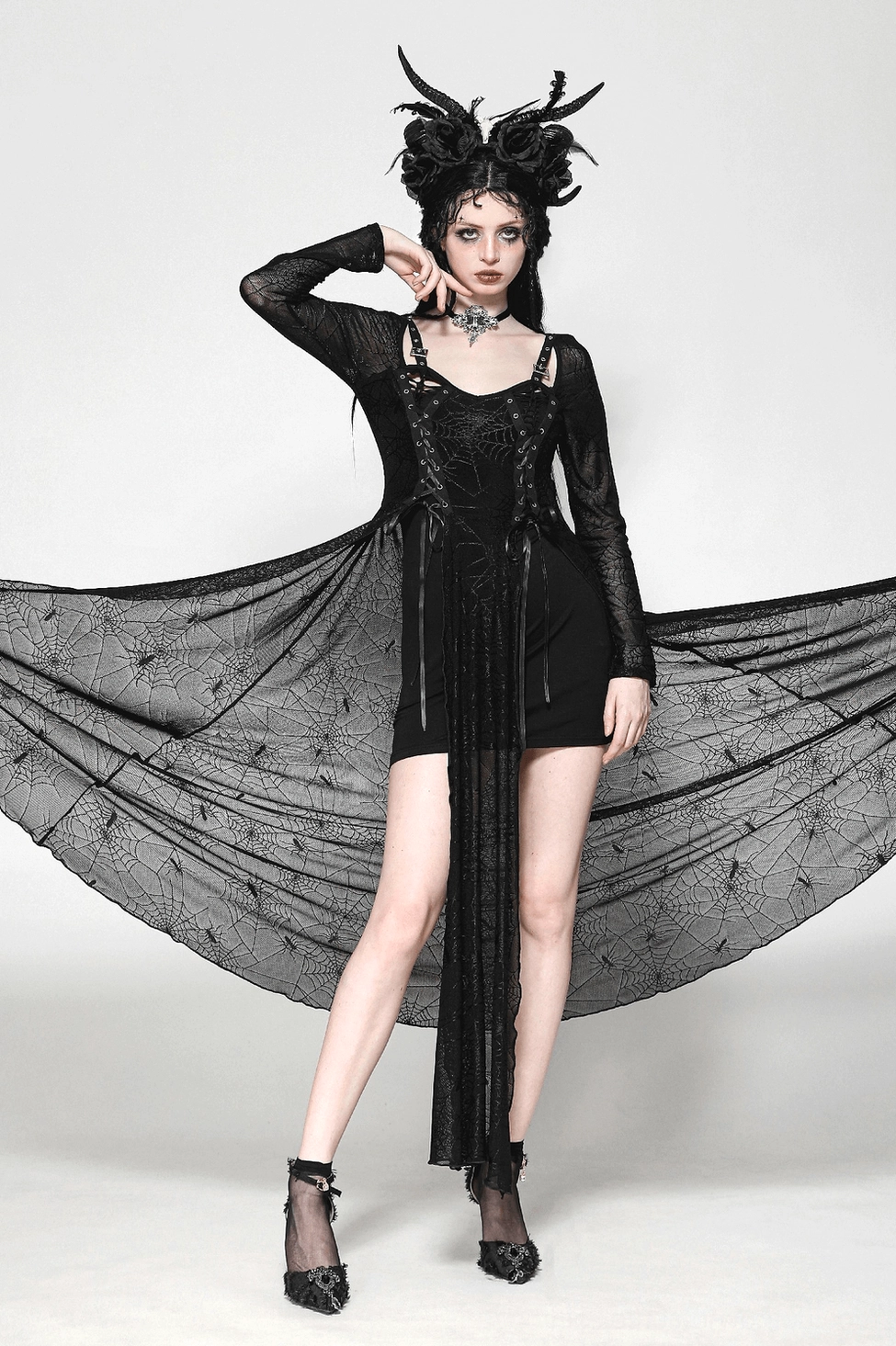 Black spiderweb lace-up gothic dress lower skirt detail showing floor-length sheer mesh panels