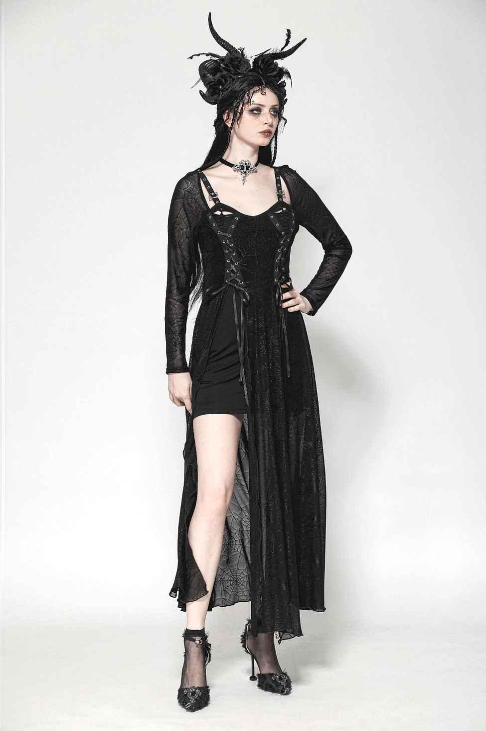 Black spiderweb gothic dress styled flat lay with accessories and dramatic presentation