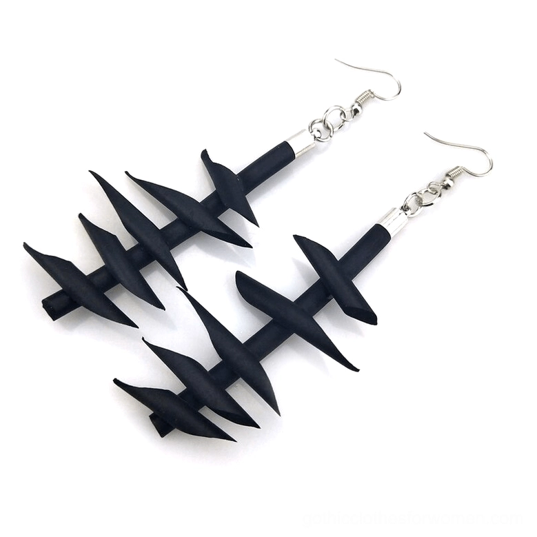 Black twisted spike rubber dangle earrings pair set matte finish flat lay gothic punk jewelry