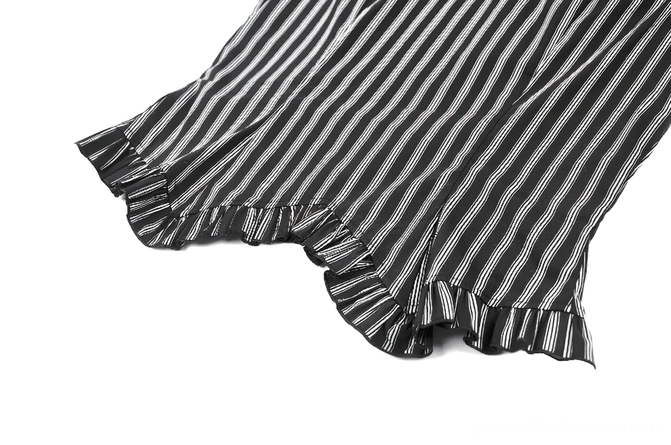 Side view close-up of ruffled cap sleeve and vertical stripe pattern on gothic blouse