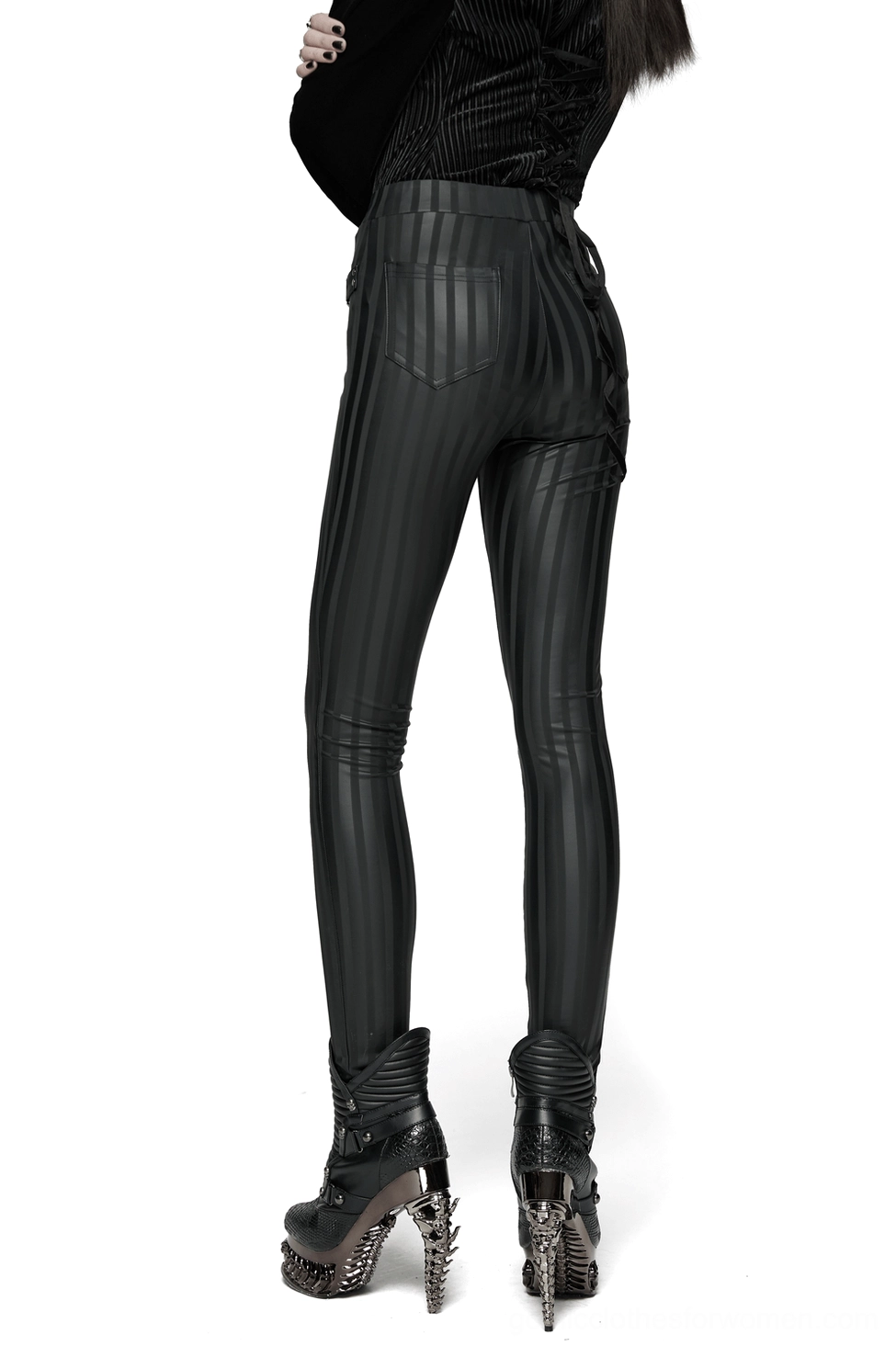 Black striped gothic leggings back view on model, showing dual rear patch pockets and slim fit with dark boots