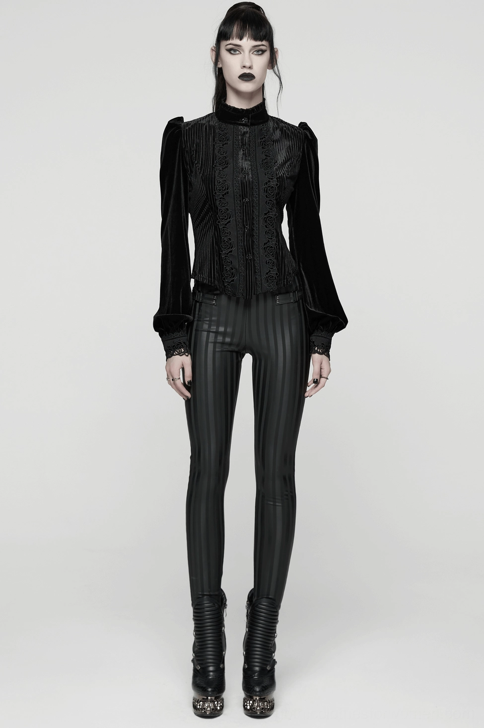 Black striped gothic leggings detail shot emphasizing slim-fit design, buckle hardware, and neo-gothic vertical stripe motif