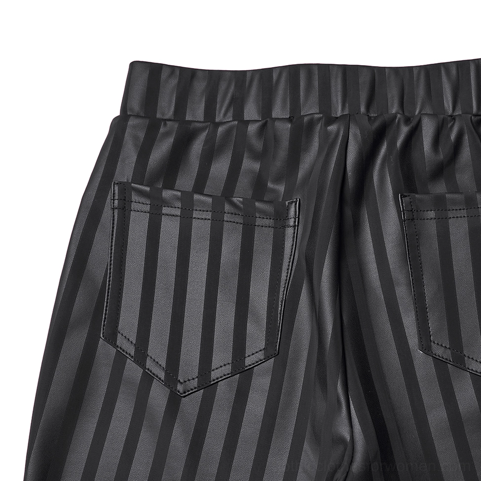 Close-up detail of black striped gothic leggings rear pockets, vertical stripe print, and elastic waistband construction
