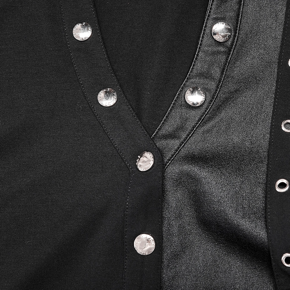Close-up detail of rhinestone stud buttons on black crop top with V-neck design and leather-like fabric