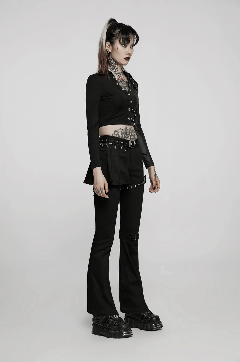 Black studded crop top detail view showing hardware precision, stud quality and studded accents