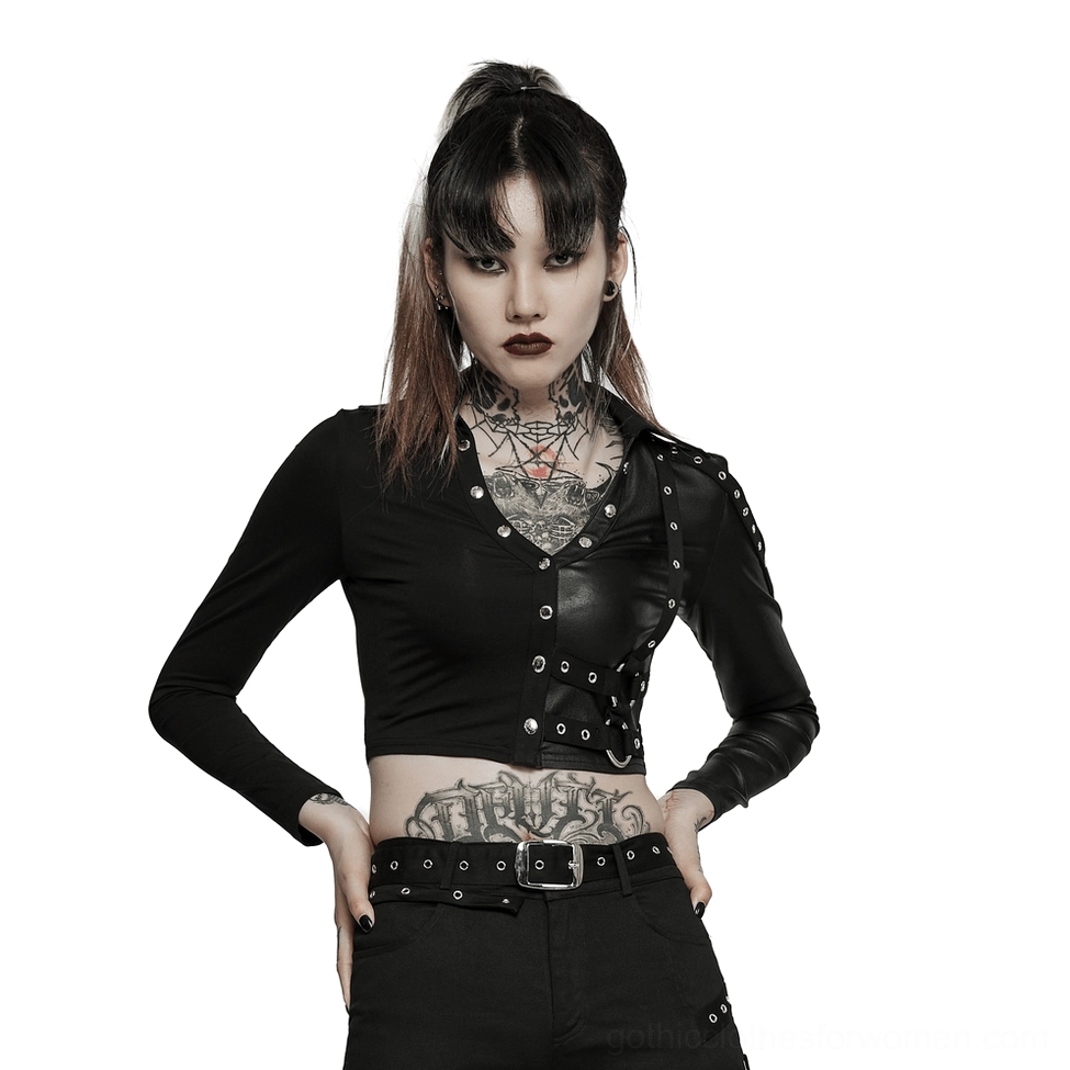 Black studded crop top with harness details and long sleeves, front 3/4 view on tattooed model