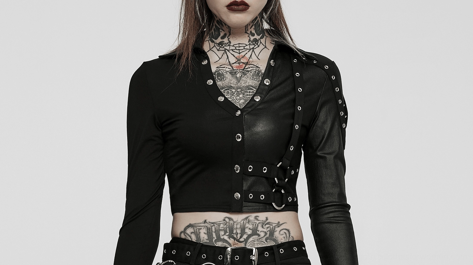 Gothic black crop top with studded embellishments, overhead flat lay showing stud placement and design