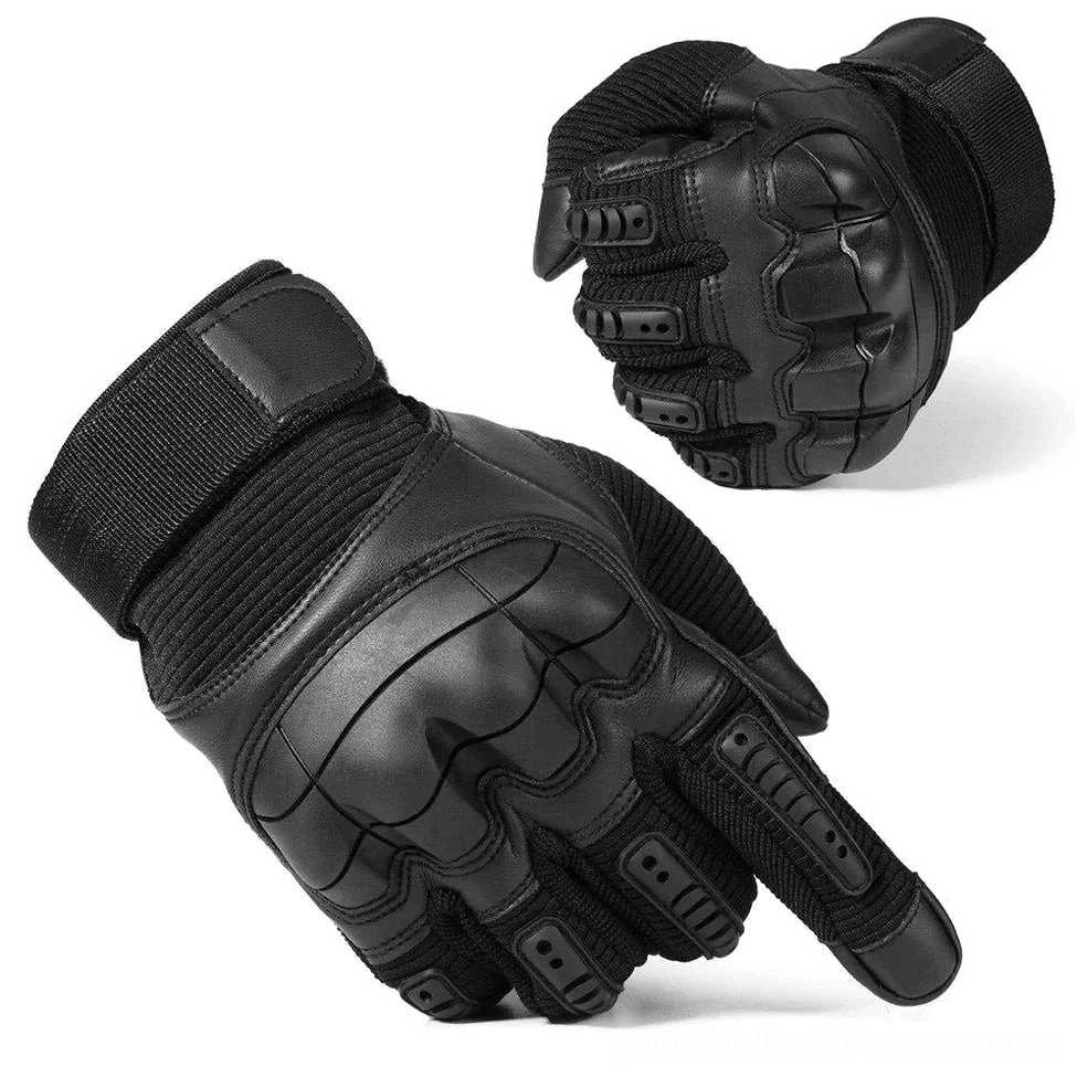 Black hard knuckle tactical combat gloves with reinforced knuckle guards, oblique front view on studio white background