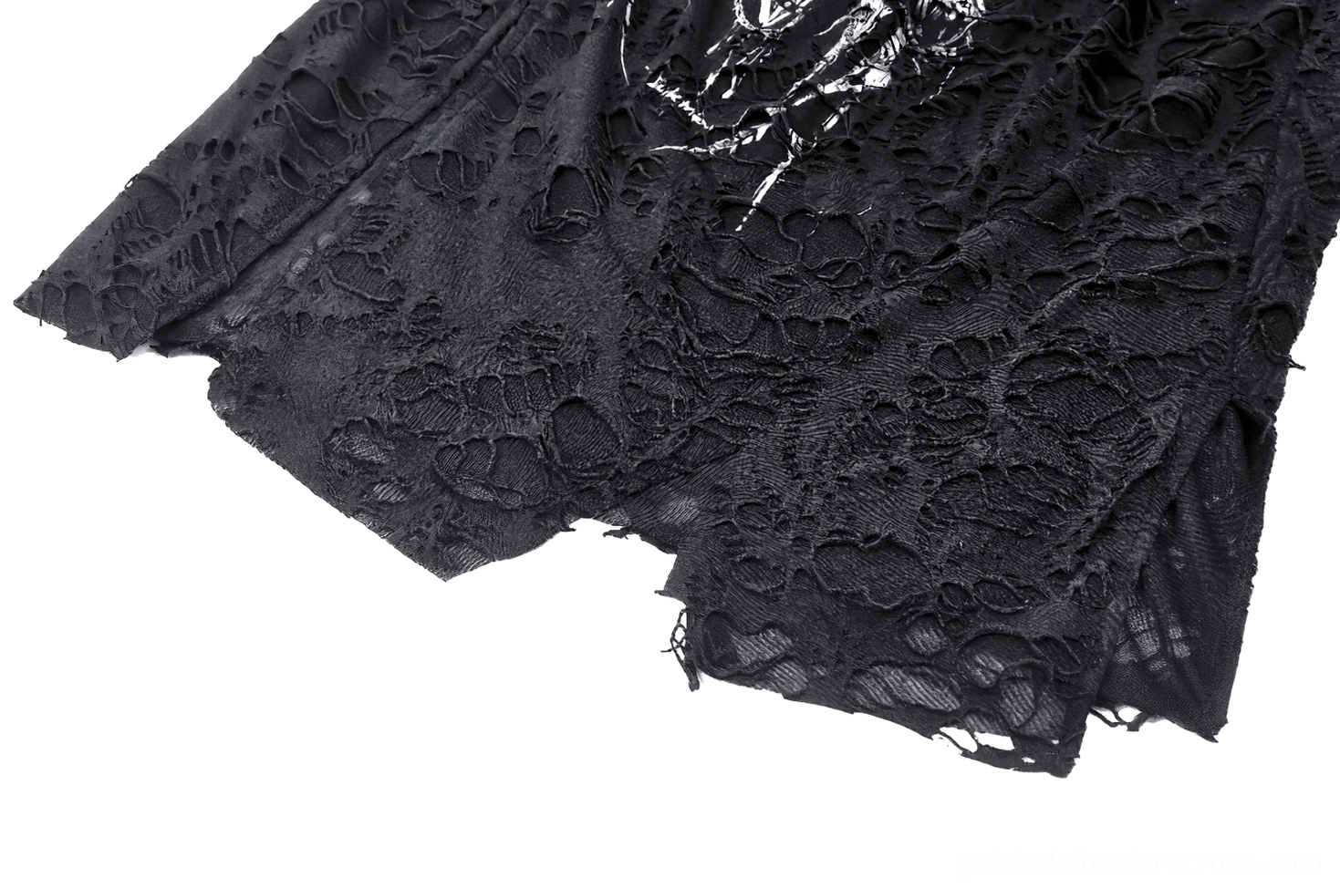 Close-up of silver skull print and asymmetric distressed hem detail