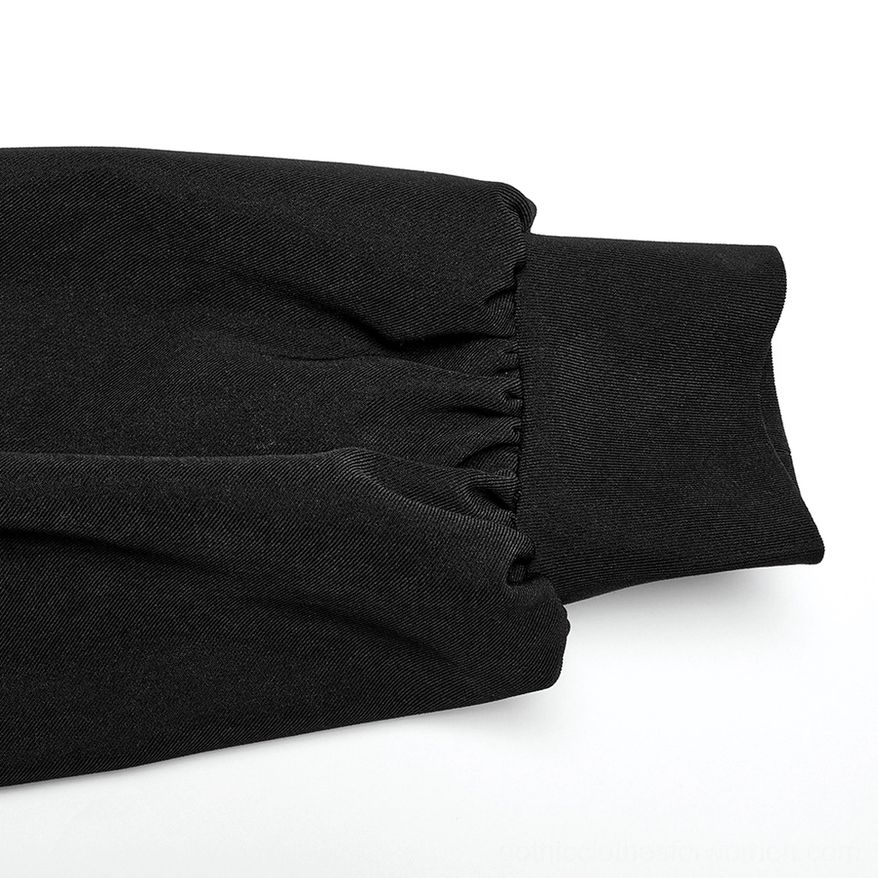 Close-up detail of black gothic dress bishop sleeve cuff with shirred elastic binding and woven fabric texture