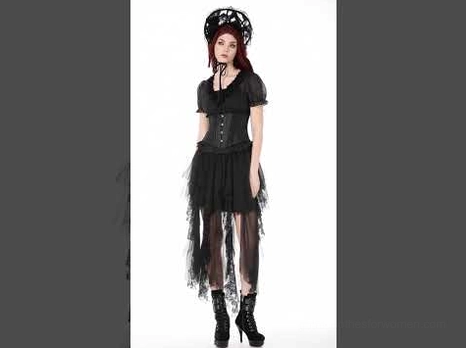 Female model wearing black asymmetrical tulle skirt with high-low fringe hem and ankle boots