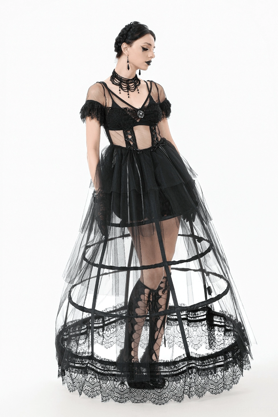 Black lace gothic dress detail shot emphasizing tulle layers and intricate lace construction