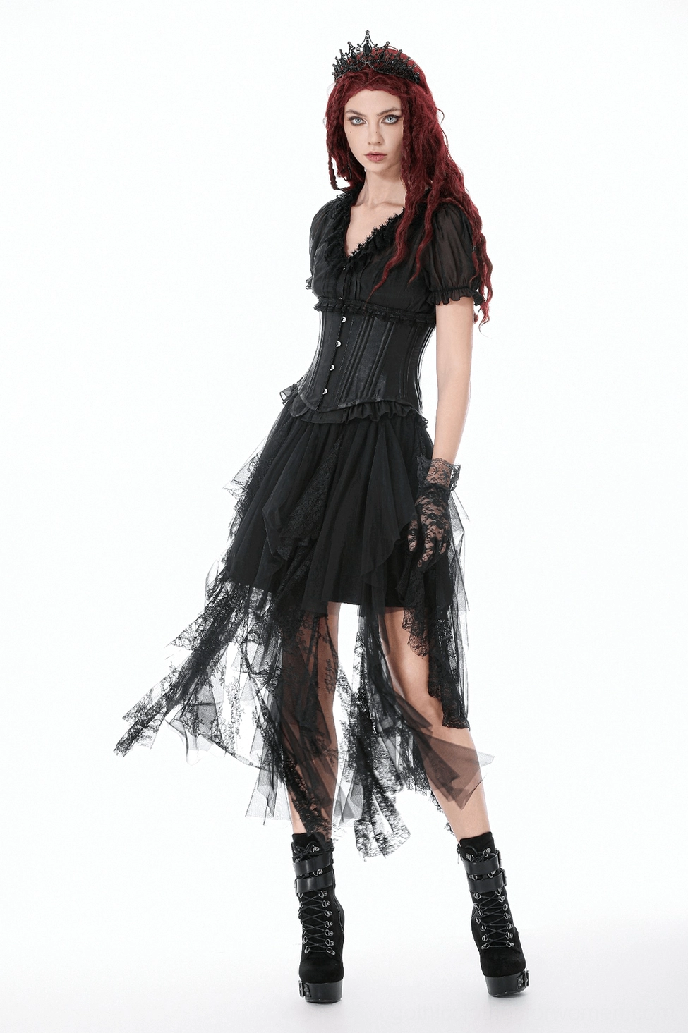 Black tulle skirt showing full asymmetrical silhouette and dramatic layered hem construction