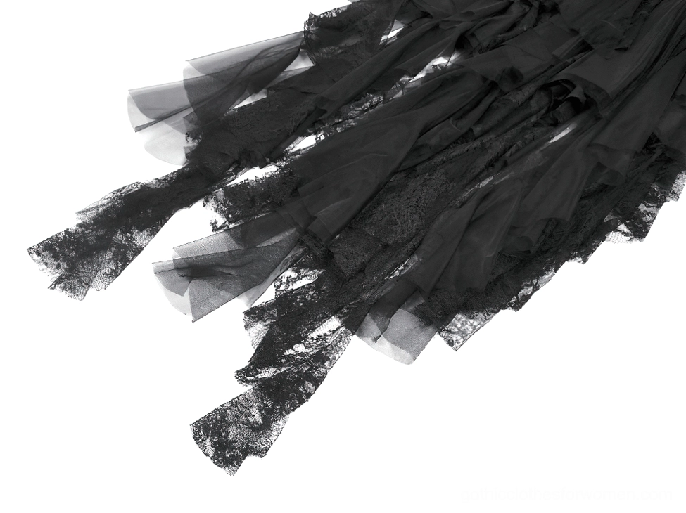 Detailed close-up of asymmetrical tulle lace hem and layered sheer tulle fringe trim